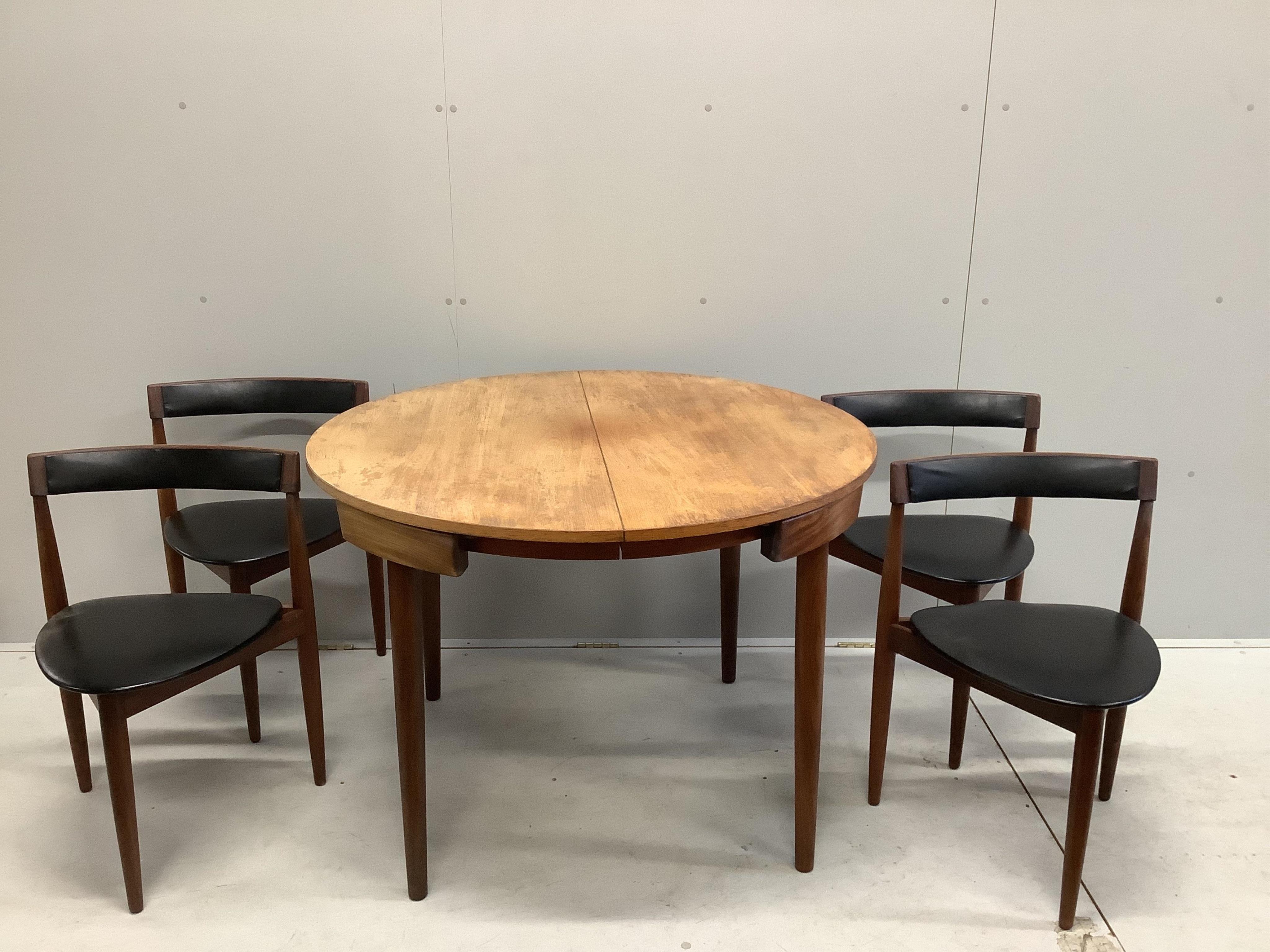 Hans Olsen for Frem Rojle, a mid century Danish teak 'Roundette' dining table, 156cm extended, depth 106cm, height 74cm together with four chairs. Condition - fair, top severely sun faded